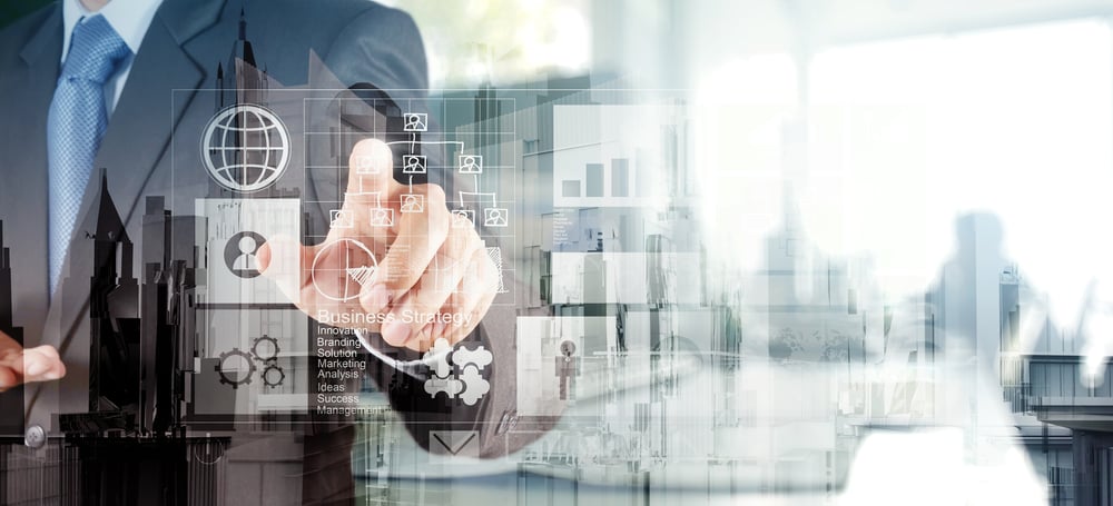 Double exposure of businessman hand working with new modern computer and business strategy as concept Double exposure of businessman hand working with new modern computer and business strategy as concept